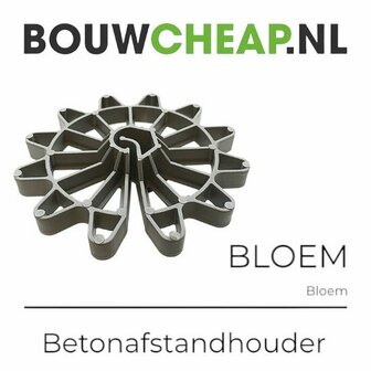 Grijze betonafstandhouder in de vorm van een bloem met uitgesneden details en een stervormig ontwerp.