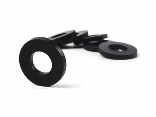 Twee witte ronde schijfjes van kunststof met een centrale opening, geplaatst op een grijze ondergrond.