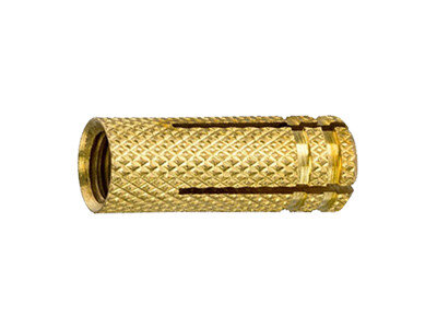 Ovale gouden moer met een geribbeld patroon en twee schuine inkepingen aan de zijkanten.