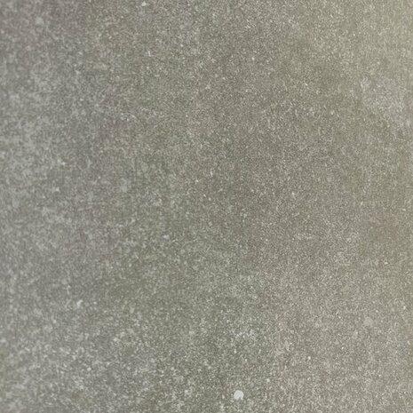 Een gelijkmatige, lichtgrijze textuur met een subtiele glans en fijne, heldere deeltjes verspreid over het oppervlak.